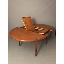 Stunning Round Teak Dining Table With A Hidden And Pull Out Extension Leaf Was Produced In 1960s T Antique Dining Room Table Antique Dining Rooms Coffee Table