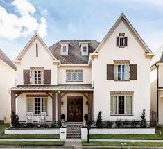 Black And White Painted Brick House White Painted Brick With Wood Accents Modern Farmhouse Exterior Brick House Plans Farmhouse Exterior