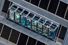 The tilt ride in the john hancock center observatory tilts people out 30 degrees to see the view 1000 feet below. Steeling Your Nerves At 360 Chicago S New Tilt Citypass Sammelalbum