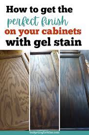 How To Gel Stain Your Cabinets On A Budget Budgeting For Bliss Video Video Stain Kitchen Cabinets Diy Stain Kitchen Cabinets Dark Stained Kitchen Cabinets