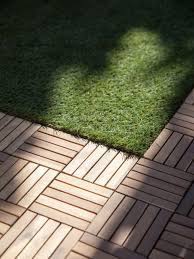 How to transition wood floors to sliding glass doors and tile. Wood Deck Tiles Over Grass Wood Deck Tiles Outdoor Tile Patio Outdoor Deck Tiles