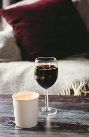 Shenzhen xgc lit furniture co., ltd. A Lit Candle And A Glass Of Red Wine On A Coffee Table By Helen Rushbrook Candle Red Wine