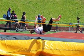 The high jump is a track and field event in which competitors must jump unaided over a horizontal bar placed at measured heights without dislodging it. File Barefoot Girl In High Jump 3 Jpg Wikimedia Commons