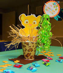 Kevin and eniko hart celebrated their baby boy's upcoming arrival with a lion king themed baby bash. Homemade Lion King Baby Shower Centerpieces Lion King Baby Shower And How To Put It Together Home Par Lion King Baby Shower Lion King Baby Lion Baby Shower