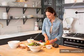 Get our best advice for making the most of your kitchen. Woman Cooking Dinner At Kitchen Food And Drink Organic Stock Photo 157571540