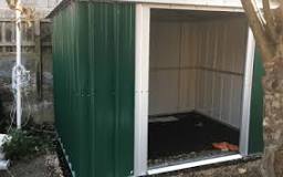 How do you secure a metal shed base?