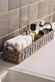 Basket For Towels And Toiletries Near The Bathtub Affordable Decor Bathroom Decor Bathroom Makeover