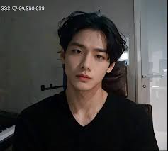 A close up of a person with a black shirt and a piano