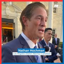 L.A. County District Attorney George Gascón is battling for another  four-year term against challenger Nathan Hochman, a polished former federal  prosecutor and criminal defense attorney who has the backing of police  unions.