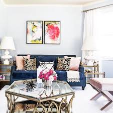 A Chic Mix Of Textures Tied Together With Leopard Print Pillows And A Crush Worthy Blue Sofa Feminine Living Room Room Inspiration Couches Living Room