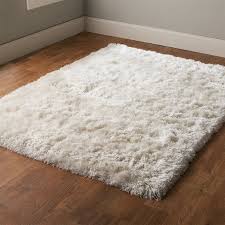If your polypropylene rug is in need of a general cleansing, the material is durable enough that you can spray it off and scrub it down. Shaggy Shiloh Hand Tufted Rug White Shag Rug White Rug Fuzzy White Rug