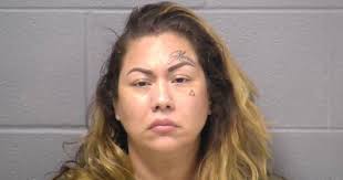 Joliet woman crashed into residence with vehicle, bit hospital guard's arm:  cops