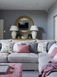 Grey Walls And Sofas With Pink Accents Work Beautifully Together In This Stylis Farm House Living Room Modern Farmhouse Living Room Farmhouse Decor Living Room