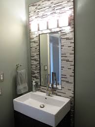 Check out these back painted glass backsplashes. Powder Room With Glass And Metal Mosaic Backsplash And Furniture Style Vanity Cabinet Powder Room Sink House Bathroom Powder Room