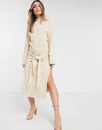 Although the knit tie appears to be a new trendy accessory, it's actually been around for quite some time. Sndys Tied Up Knit Dress In Sand Asos