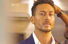 Tiger Shroff S New Look Will Make You Go Weak In Your Knees Now, tiger shared a video from the the director ahmed khan was there by his side as he got his hair cut. tiger shroff s new look will make you