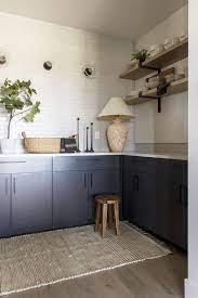 Painting the huge island a dark, grounding colour (sherwin williams cyberspace) was a great way to slow things down and give the space a solid foundation for the remaining wood to really dance (and you all know how i love to make wood dance)!. Sherwin Williams Sw 7069 Iron Ore Pantry Cabinet Paint Color Pantry Cabinets Are In Sherwin Williams Sw 70 Black Modern Farmhouse Kitchen Design White Interior