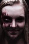 Creepy, demon, scary, Halloween, dark, red, black eye, one eye, smile by Allyson  Collins. Photo stock