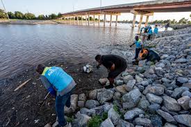 Volunteers gather for an environmental cleanup of Riversport OKC
