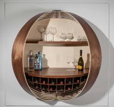 Three wire racks are specially designed for. A Wall Mounted Bar Cabinet Inspired By A Spinning Coin