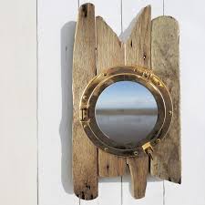Make your bathroom feel like a ship cabin with a porthole mirror. Driftwood Porthole Cabinet Bathroom Cabinet Nautical Decor