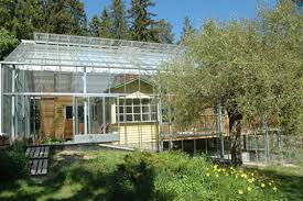 Hoop houses are considered one of the most inexpensive designs, with overall construction often less than $1 per square foot. Naturhus An Entire House Wrapped In Its Own Private Greenhouse