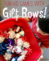 Little Family Fun Christmas Games With Gift Bows Christmas Gift Games Preschool Christmas Games School Christmas Party