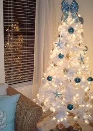 See how they decked out christmas trees with creativity and personality. 25 Coastal Christmas Holiday Trees Inspired By The Sea Coastal Decor Ideas Interior Design Diy Shopping