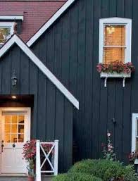 Often the exterior of a black house is a different material from plain wood or siding, ranging from metal or special wood cladding. Dark Blue Houses