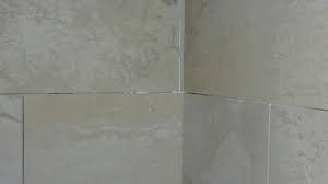 The tiles are not flush throughout. Help Uneven Tiles In Corner Should I Have Them Reset