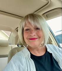 Introduction of a retired lady with interests in vintage clothes and cars