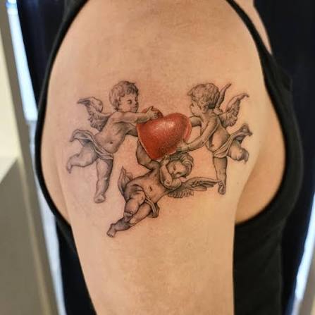 Custom cherubs holding a heart ❤️ His first tattoo 💪 I love doing custom pieces like this 😍 DM to collab on awesome tattoos ✨️🤩 #tattoo #tattoos #tattooartist #realismtattoo #blackandgreyrealism #blackandgreytattoo #bayonnenj #