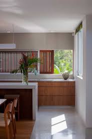 Modern asian kitchen design engulfed in ample dark wood. Modern Asian Aesthetic For Beach House At White Rock