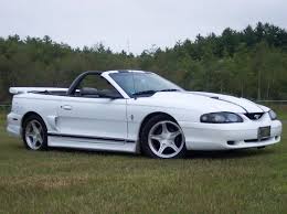 Silver metallic 2003 10th anniversary svt cobra convertible with 17 x 9 inch special svt cobra wheels, red brake calipers, black interior with red leather inserts, special carbon fiber weave leather steering wheel, 10th anniversary decklid badge and floor mats, and a modified 4.6l supercharged v8. 1997 Ford Mustang Pictures Cargurus