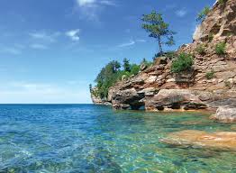 The island has only mountain bike trails, campsites, beaches, and a few (grandfathered) private vacation cabins. A Grand Escape Michigan Blue Magazine