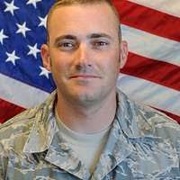 Spc. Eric Waddle, a Bedford, Ind., native, helps to