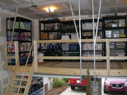 An attic ladder is a retractable stairway that pulls down from the ceiling to provide access to attic space, then folds up into a ceiling frame out of the way when it is not needed. Garage Loft Ideas And Inspiration Salter Spiral Stair