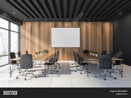 Conference room with empty chairs and a projector screen. Black Wooden Meeting Image Photo Free Trial Bigstock