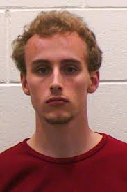 Cops: Collegian Dove Naked Into Garbage Truck