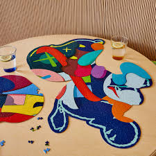 He began by graffiti tagging peanuts characters on a metlife billboard in new jersey. Kaws Jigsaw Puzzle 1 000 Pieces Moma Design Store
