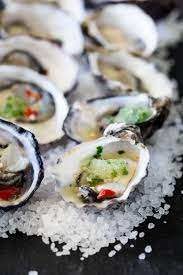 These Thai Oysters Are Dressed With A Sweet And Spicy Dressing And Then Topped With A Cooling Salty Sour Granita Oyster Recipes Seafood Recipes Homemade Sushi
