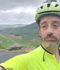 TED THORNHILL tries to cycle his 'dad belly' up Hardknott Pass in the Lake  District