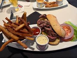 Pelican Cafe in downtown Lake Worth has new ownership. Freshly renovated,  clean, new menu with BEST SMASH BURGER IVE HAD IN YEARS, salads, a few  Indian dishes, coffee, tea, BEER AND WINE.