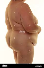 Fat naked woman standing against a white background Stock Photo - Alamy