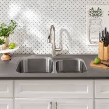 An undermount sink is installed beneath the granite countertop, usually by glueing the lips of the sink basin to the bottom of the countertop and otherwise strapping or supporting it. How To Install An Undermount Sink The Home Depot