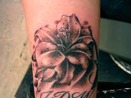Black And Grey Stargazer Lily Stargazer Lily Tattoo Wrist Tattoos For Guys Lily Tattoo