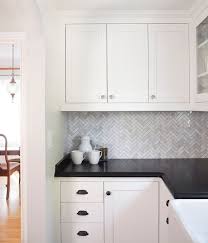 Marble Herringbone Backsplash Tile With Black Granite Counterop And Simply White On T Backsplash For White Cabinets Black Countertops Black Granite Countertops