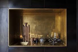 In The Black Cabin The Kitchen Is A Small Brass Inset Photograph By Darryl Ward Tiny Cabins Natural Home Decor House And Home Magazine