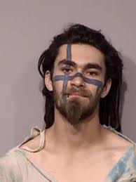 Tattooed man arrested after causing disturbance