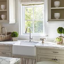 The mirrors have a wood frame the same color as the cabinets. 11 Modern French Country Kitchen Ideas